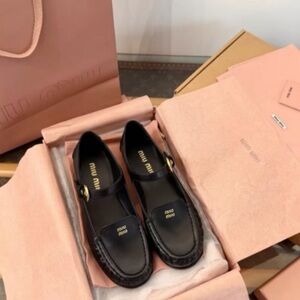 Miu Miu Black Leather Mary Jane Loafers with Gold Buckle Detail